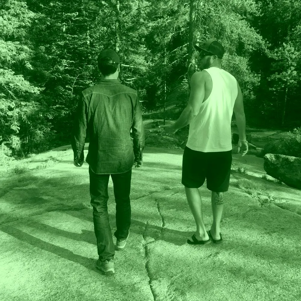 Sober companion walking in forest with client