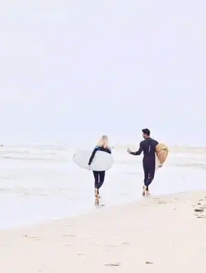 sober escort with client on beach