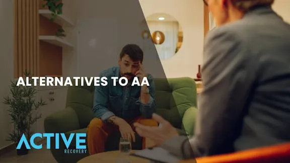 A woman speaking to a man during a counseling