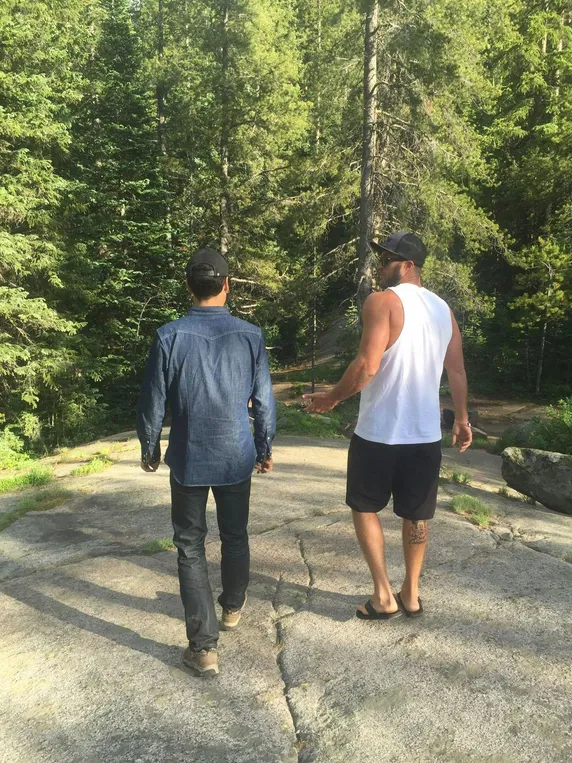 Sober companion walking with client in forest